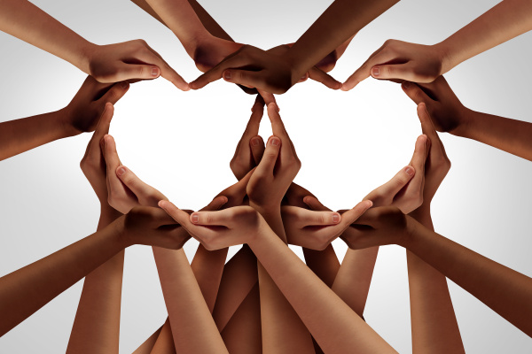 Hands coming together to form a heart